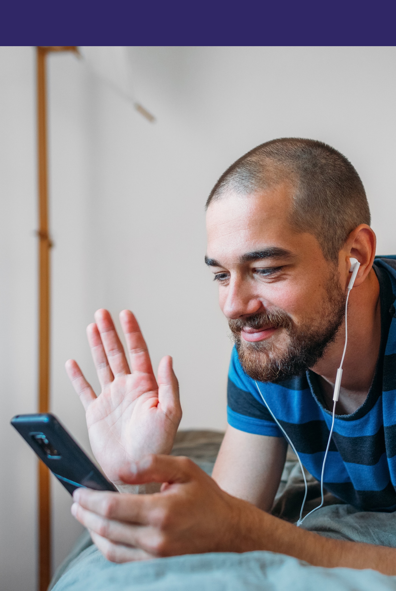 Portrait of a fine-looking man talking on a video call on his phone