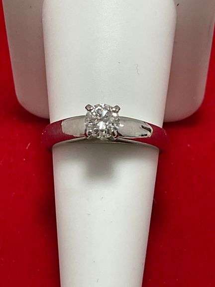 CERTIFIED PLATINUM DIAMOND SOLITAIRE RING. 0.57 CARAT