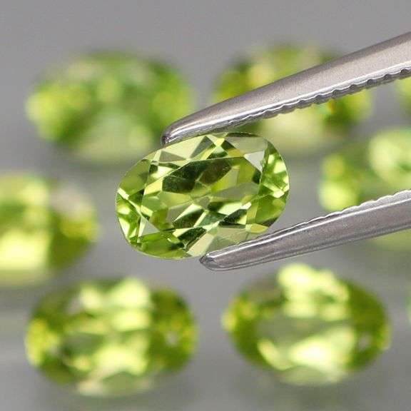 High grade 5.21ct untreated apple green Peridot set