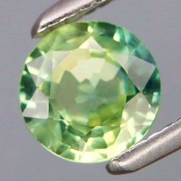 Simply gorgeous! VS grade .74ct yellow green Sapphire solitaire!