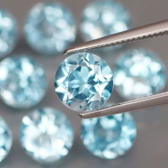 Impressive 13.08ct bright blue set of Topaz solitaires
