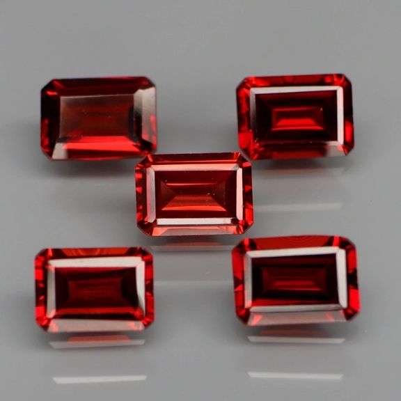Tremendous 6.18ct emerald cut cherry red Garnet set!