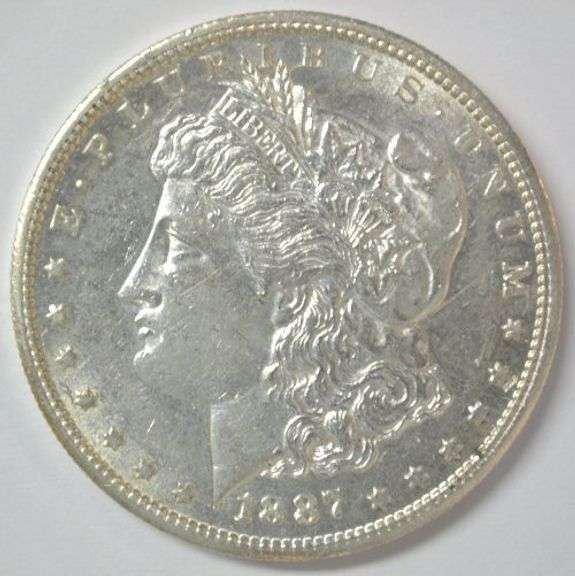 Flashy-white Near Mint 1887-S Morgan Silver Dollar. Key date