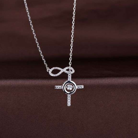 Beautiful Infinity with cross center dancing Moissanite in sterling silver