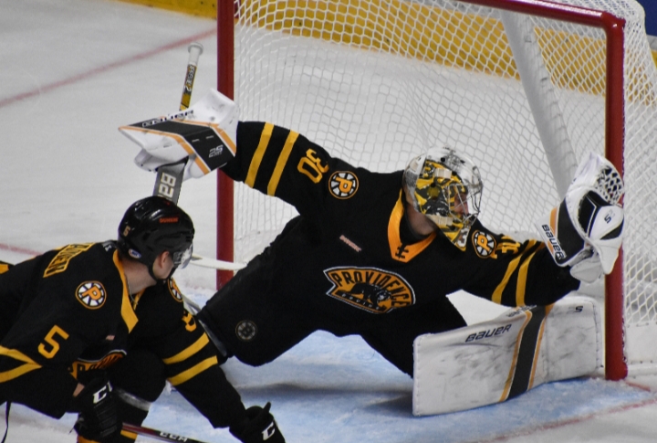 Providence Bruins goaltender Dan Vladar went post-to-post to make a glove save on Hershey Bears forward Philippe Maillet in t