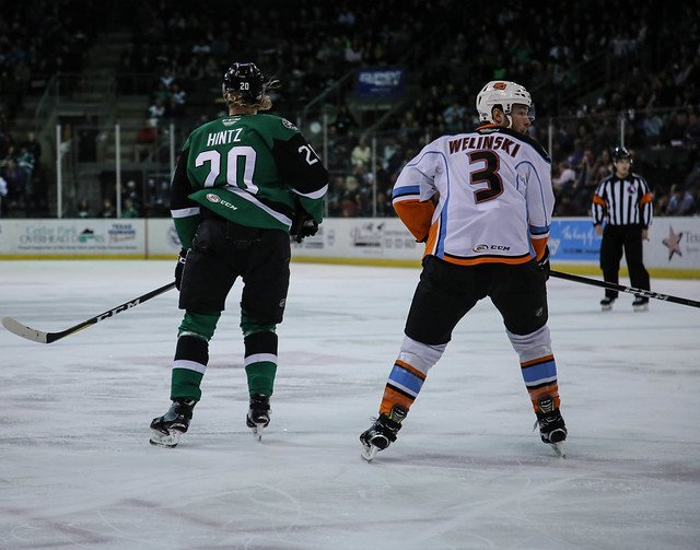 Forward Roope Hintz (#20) skates against defenseman Andy Welinski (#3) in the second period of an American Hockey League game