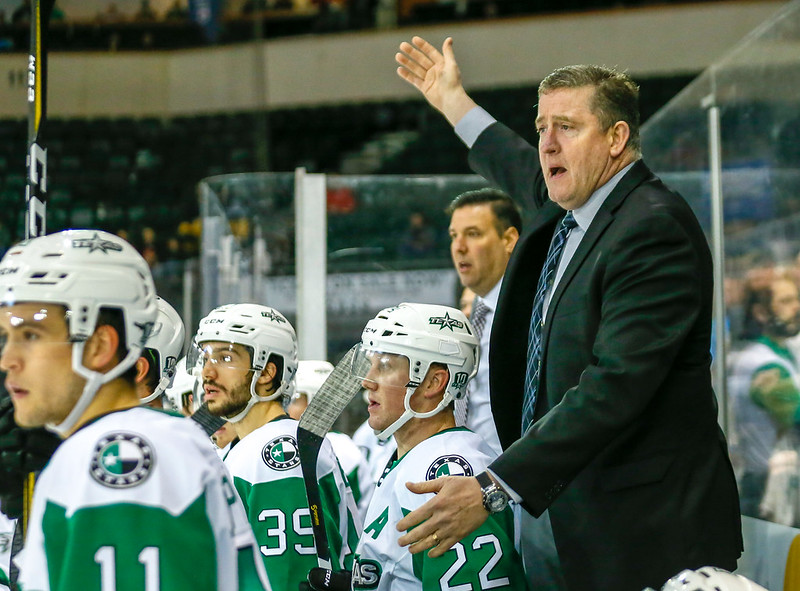 Texas Stars head coach Derek Laxdal (right) directs his team during the third period of an American Hockey League game betwee