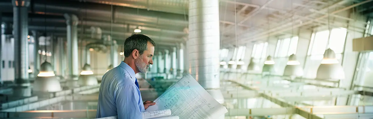 Architect viewing blueprints