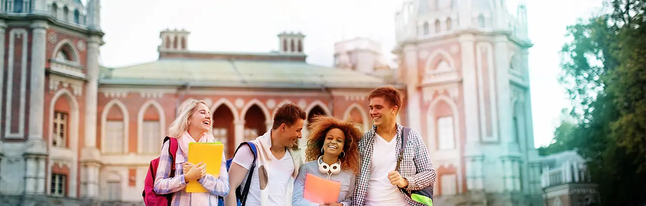 Young smiling students on campus