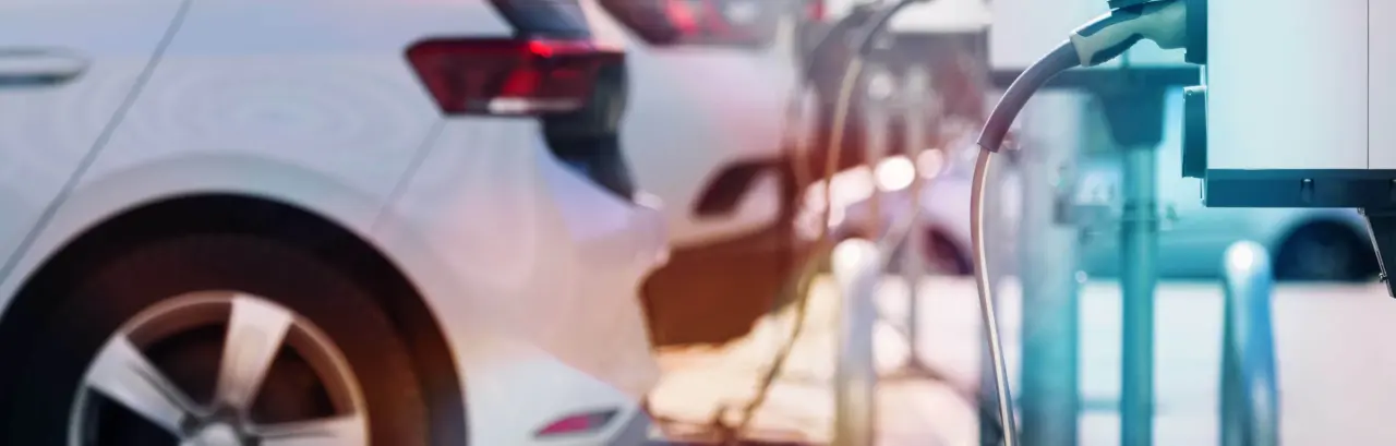 A parking lot with charging stations for electric cars.