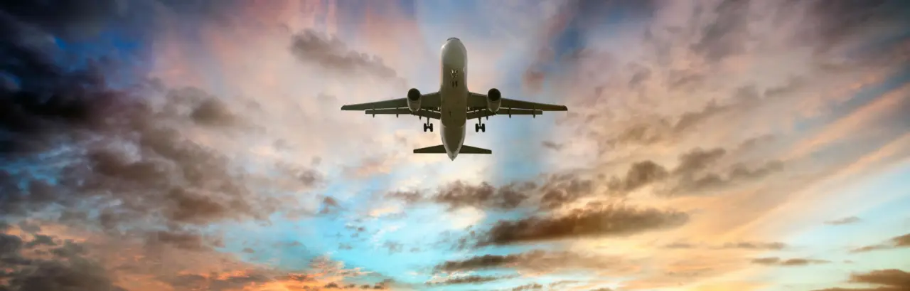 Passenger airplane taking of at sunrise