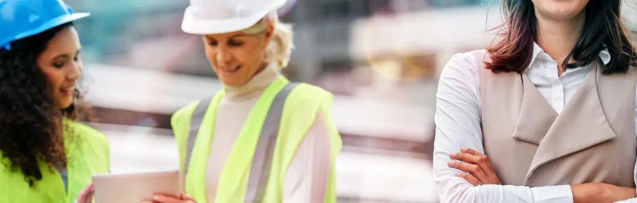 Cropped portrait of a young female engineer with her colleagues on a construction site