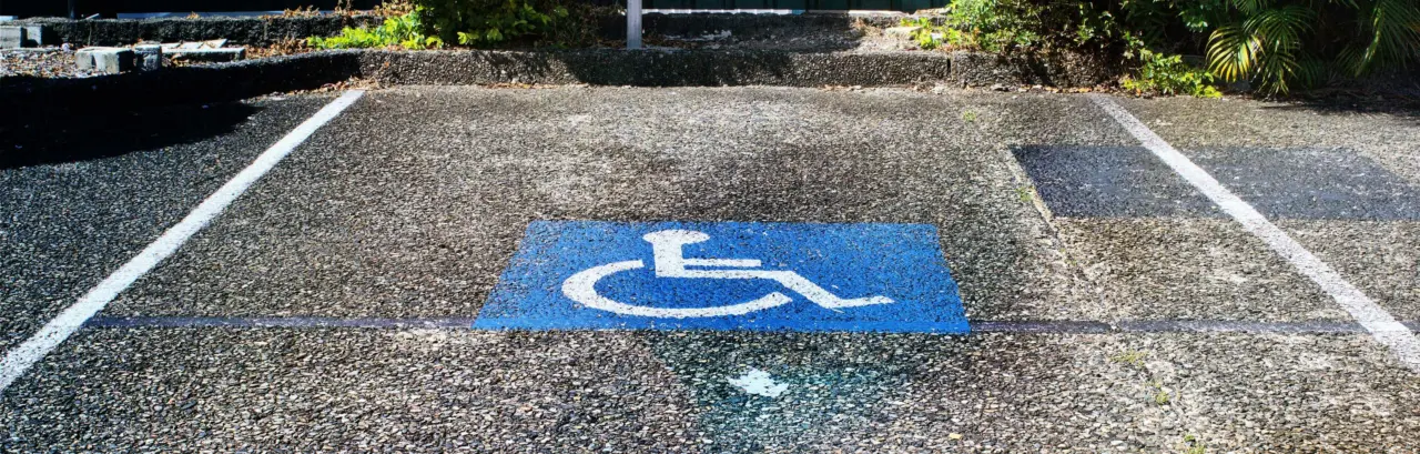 accessibility parking symbol painted on a parking spot