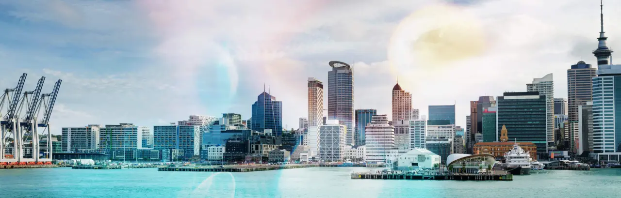 skyline of Auckland with city central business district and port cranes at cloudy noon