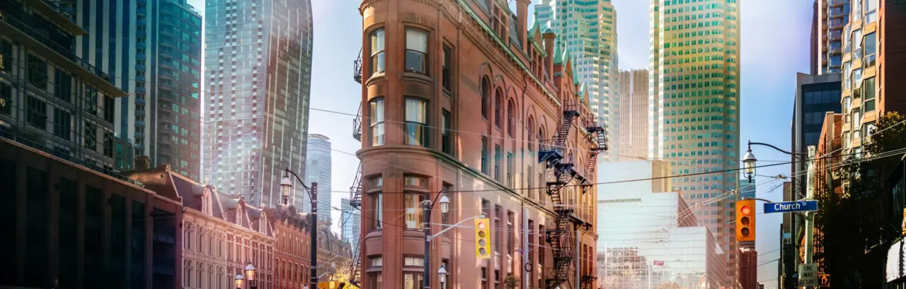 Building in downtown Toronto with CN Tower on background - Toronto, Ontario, Canada