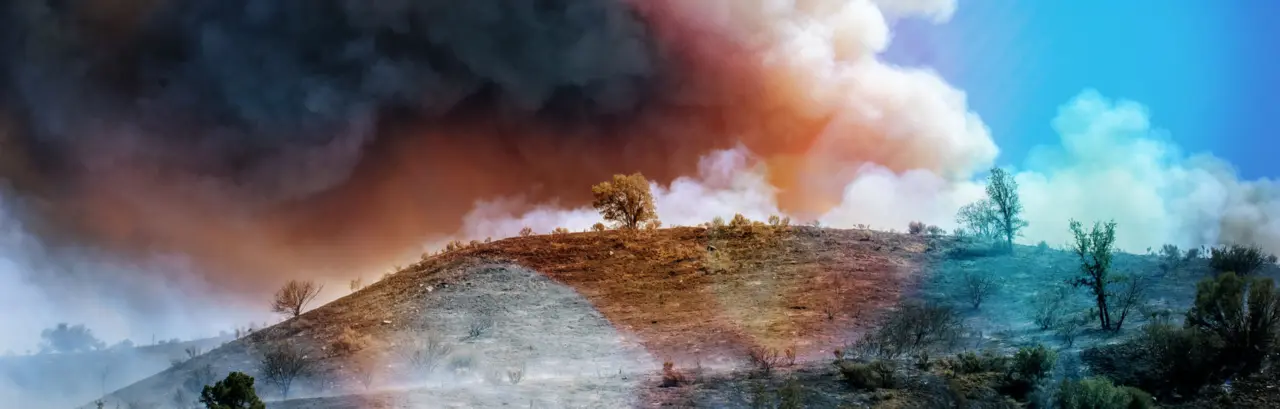 Small group of firefighters battling out of control wildfire on hilltop north of Los Angeles.