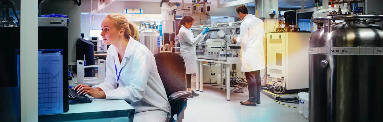 Group of medical science professionals working in a laboratory.