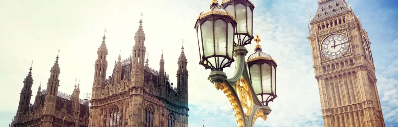 Big Ben in London with the houses of parliament and ornate street lamp