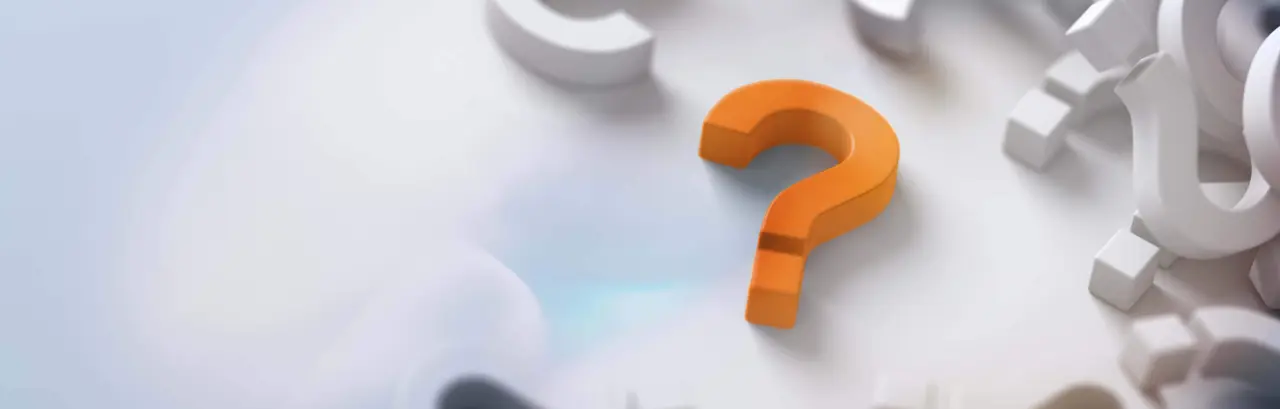 Yellow question mark standing out from the crowd of gray and white question marks in a cluster