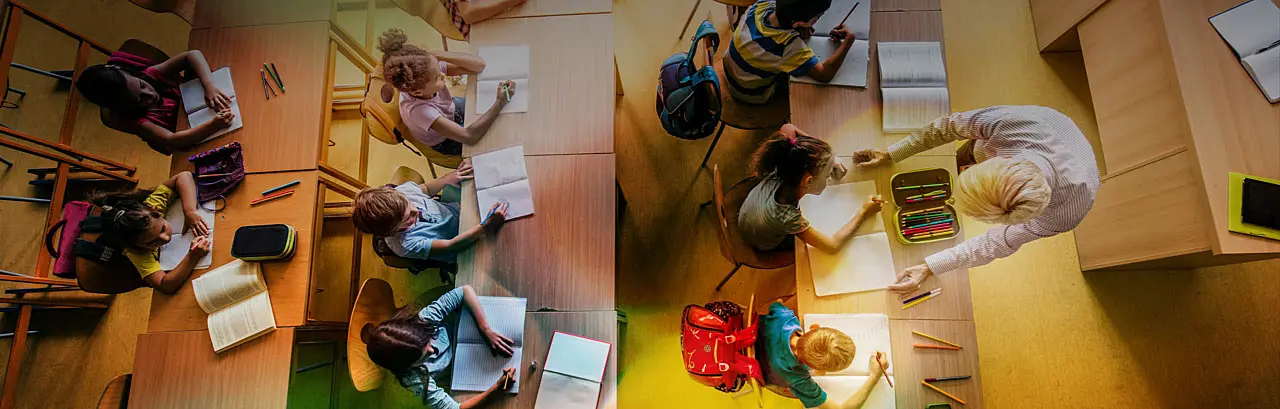 High angle view of large group of elementary students having a class in the classroom