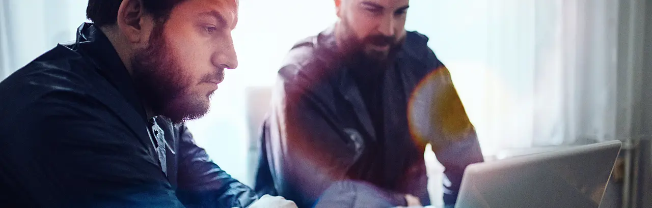 BI and CSI agents working in the office on a crime. they are working on laptop