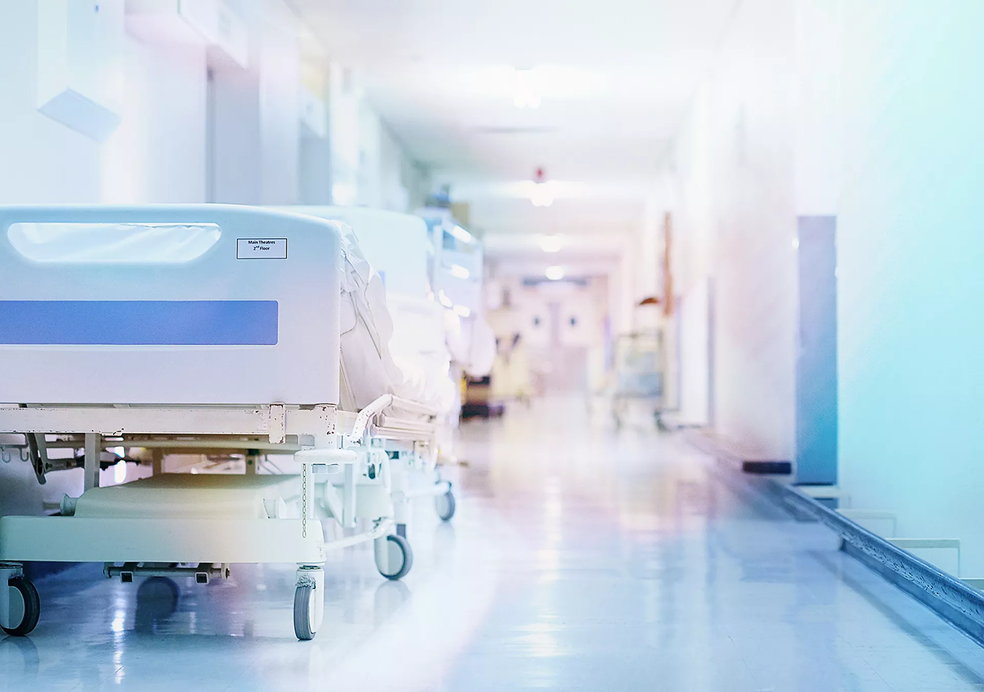 Shot of a hospital bed in an empty corridor of a modern hospital