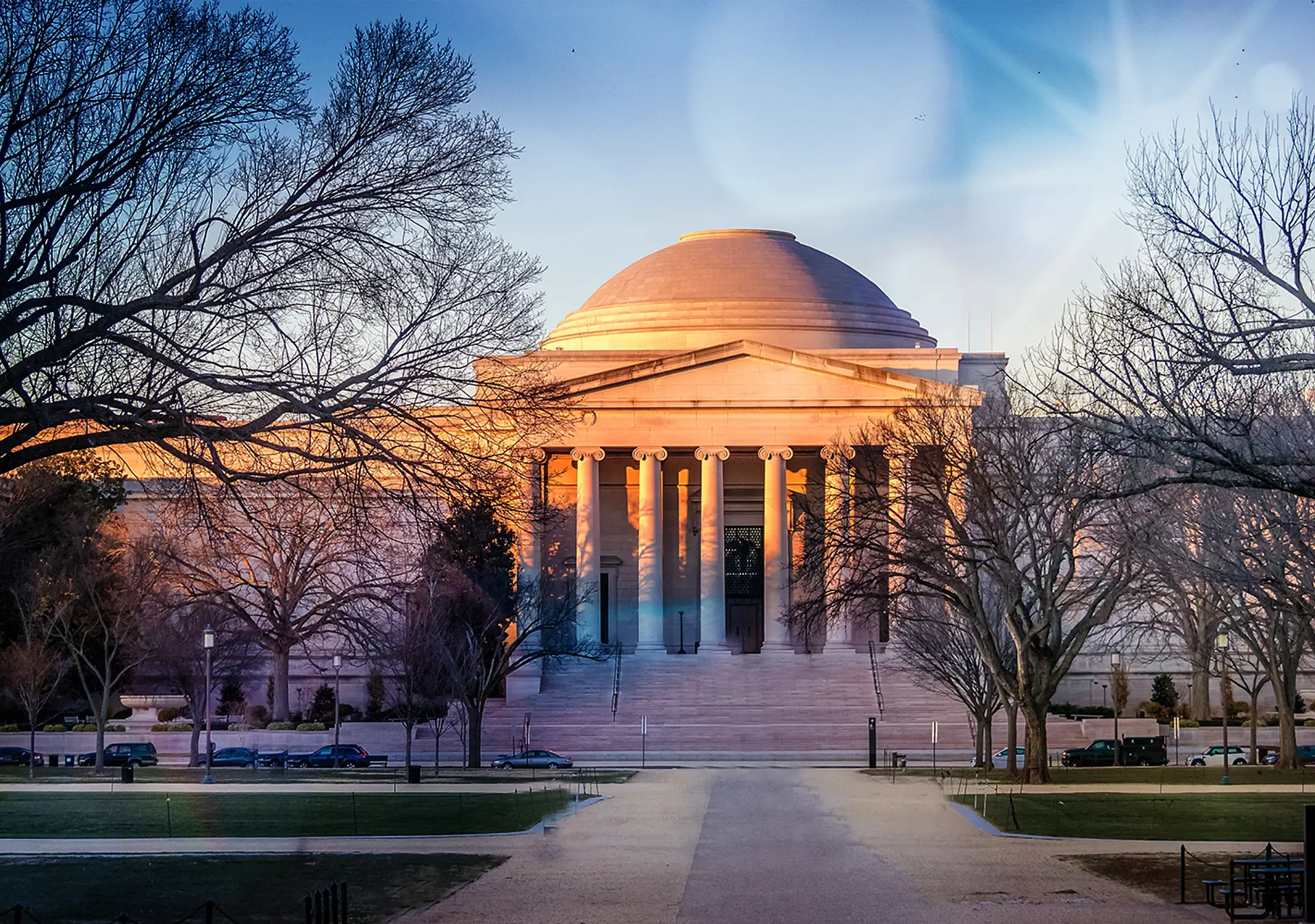 A view of the National Gallery of Art West Building at sunset in Washington, D.C.