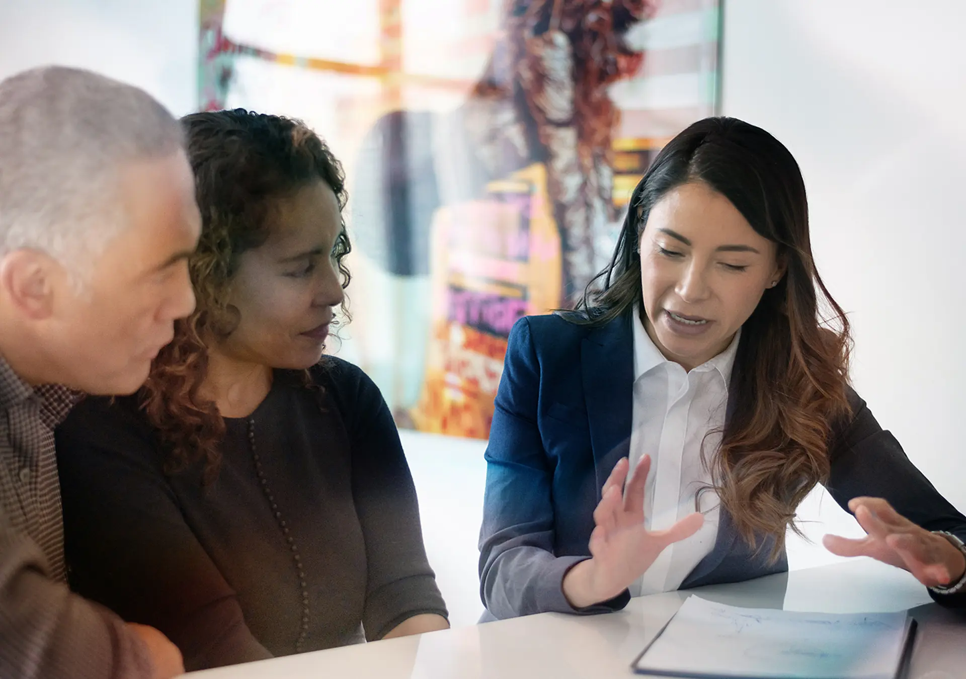 A couple is meeting with a financial advisor in the comfort of their own home.