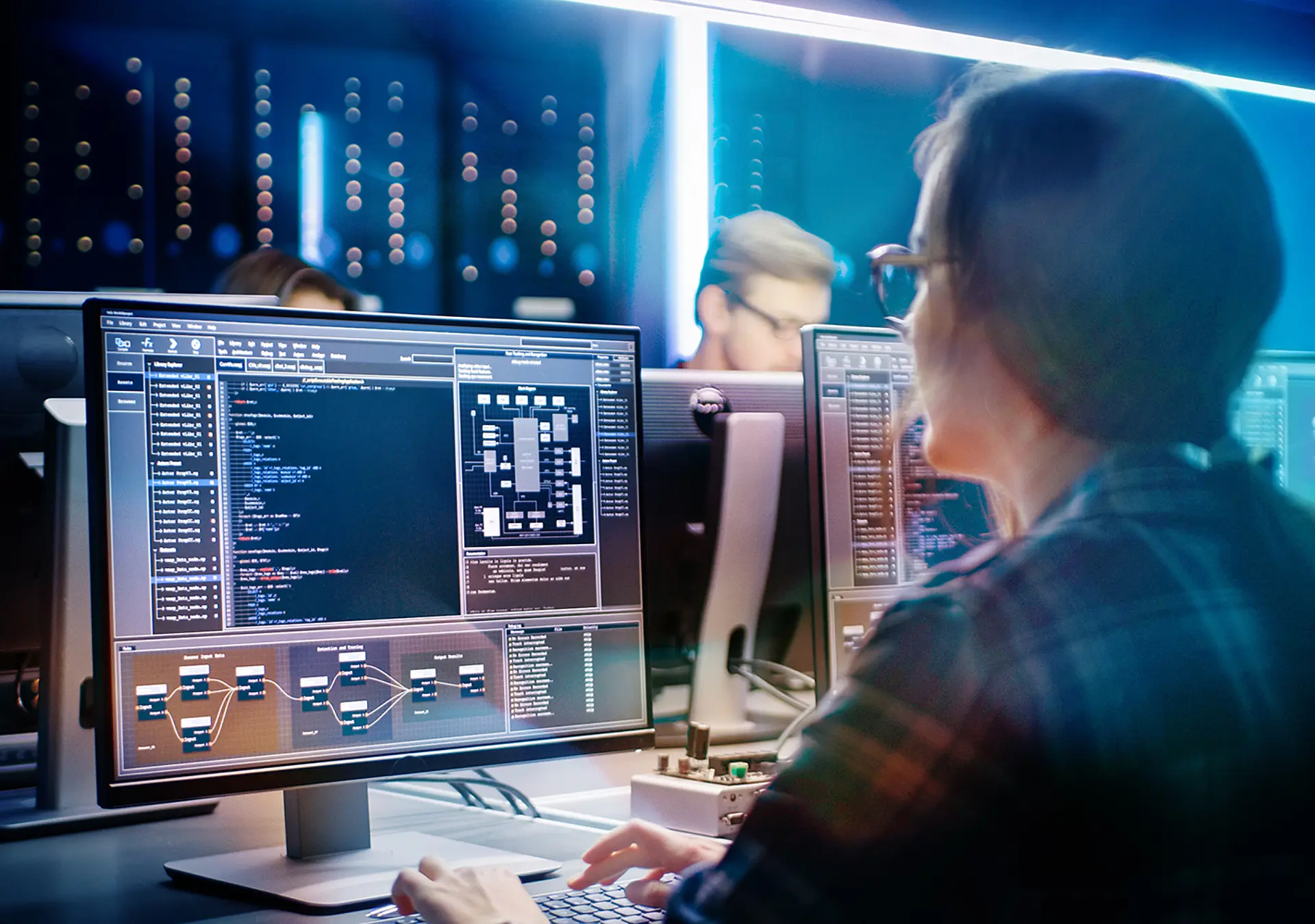 Smart Female IT Programer Working on Desktop Computer in Data Center System Control Room.