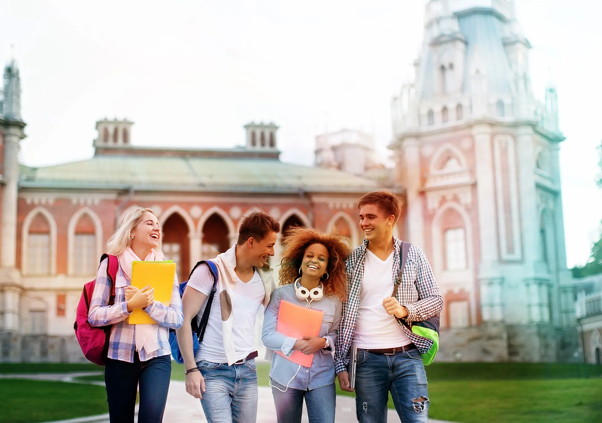 Young smiling students on campus