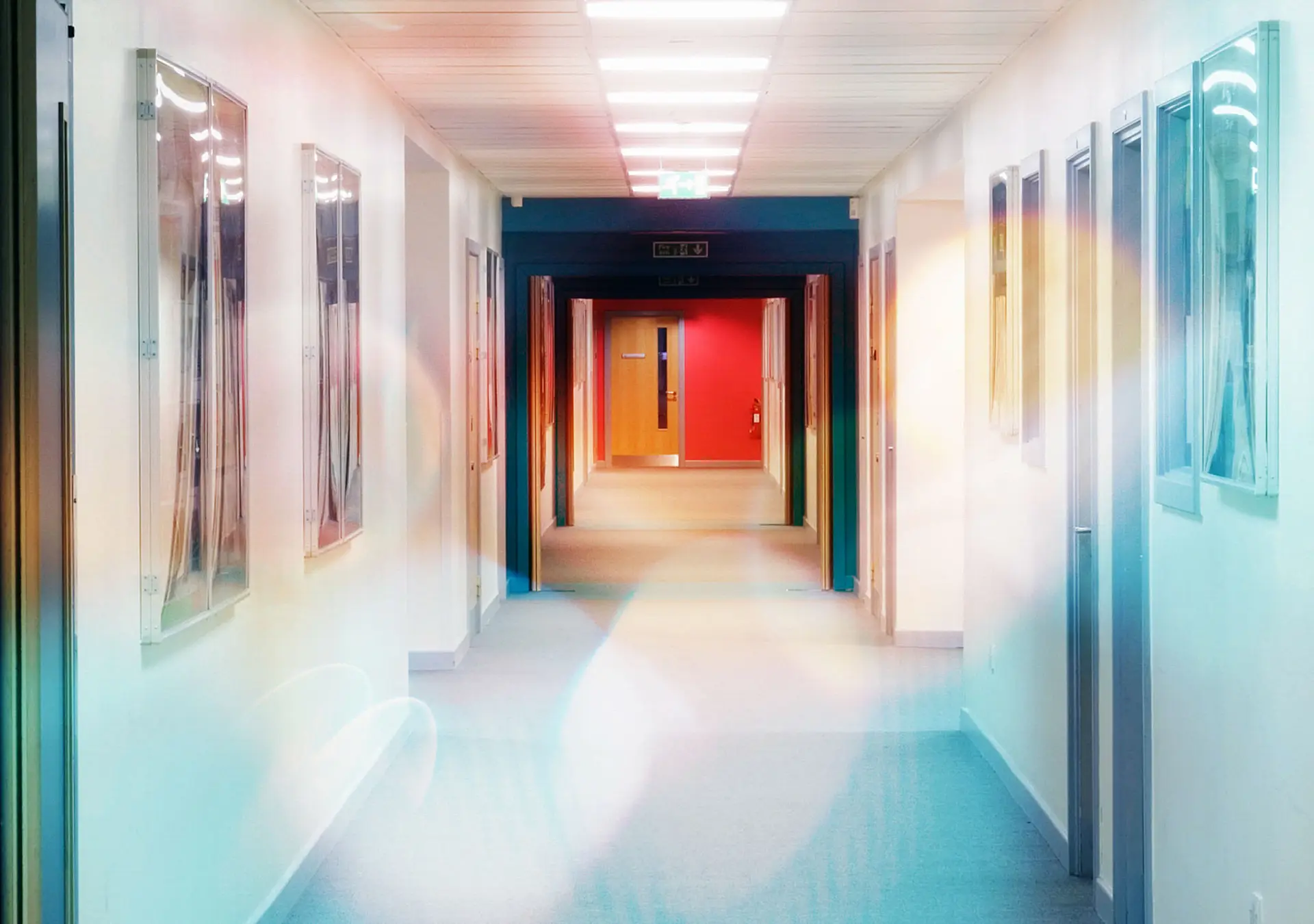 Looking along a corridor towards an exit door.
