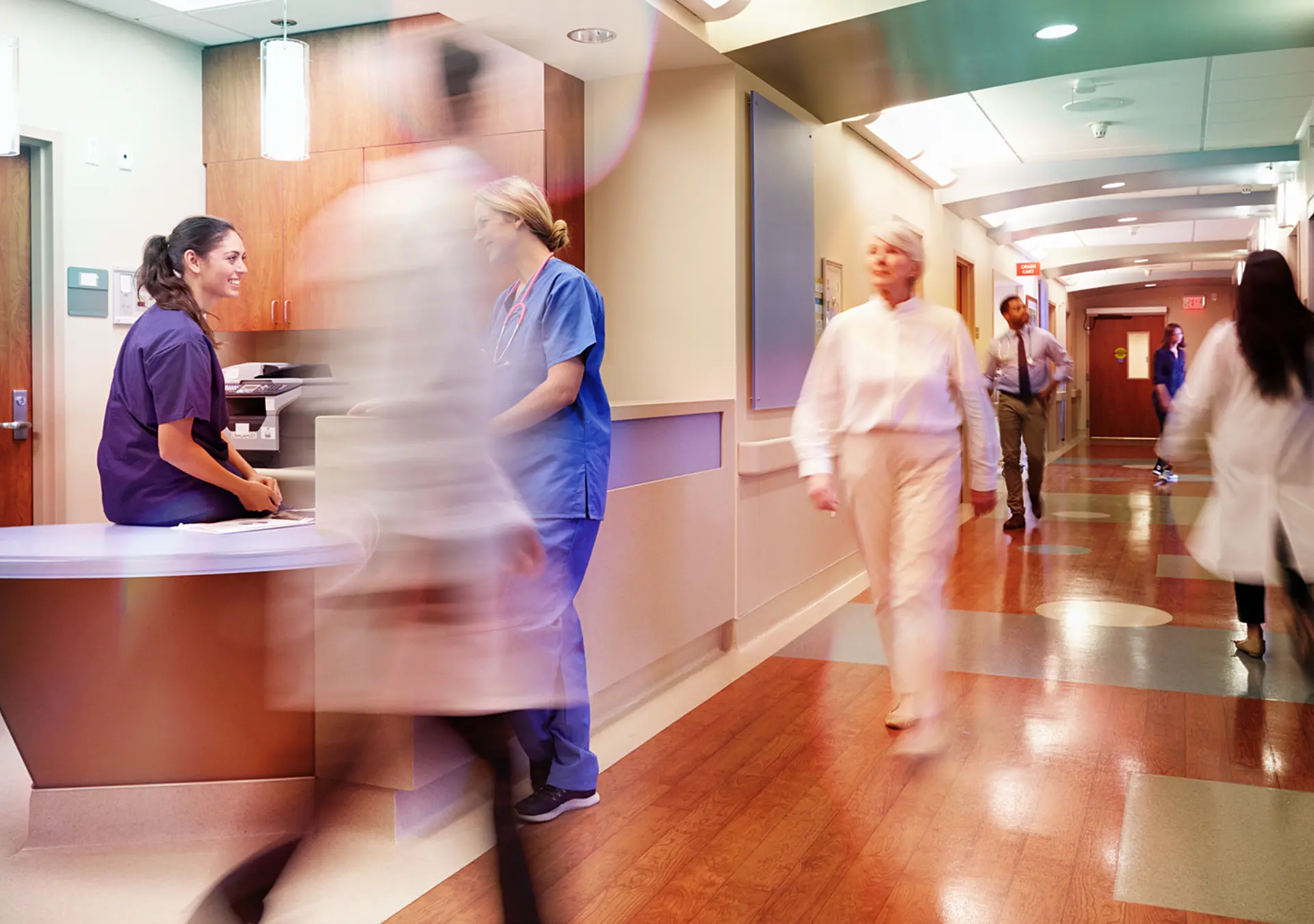 Busy Nurse's Station In Modern Hospital