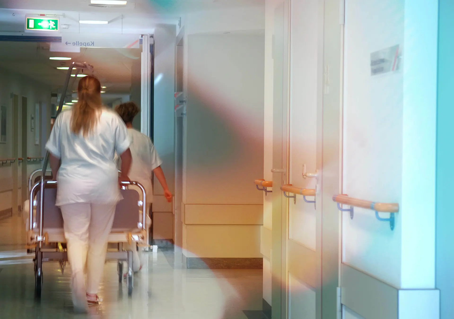 Nurses pulling a sickbed