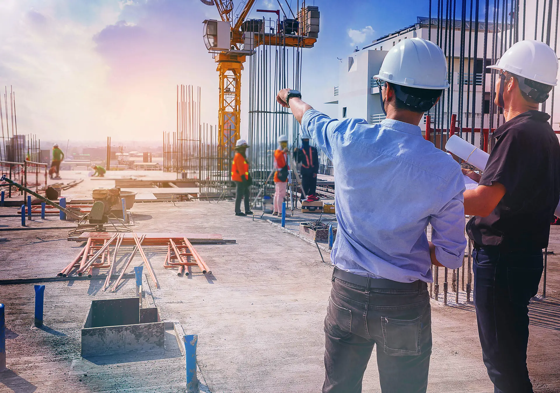 civil architect engineer inspecting and working outdoors structure building site with blueprints.