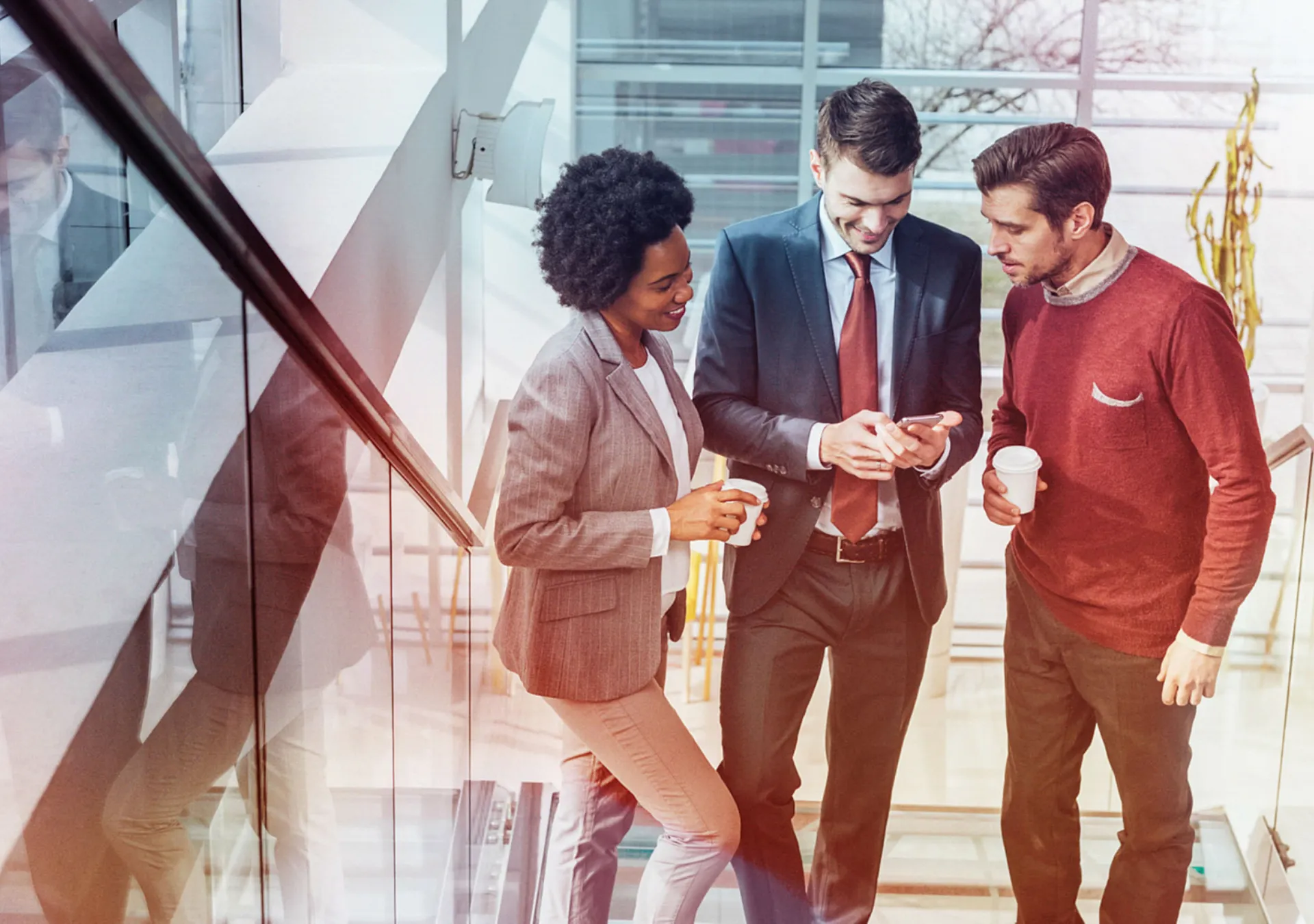 Successful business people using a technology during office break