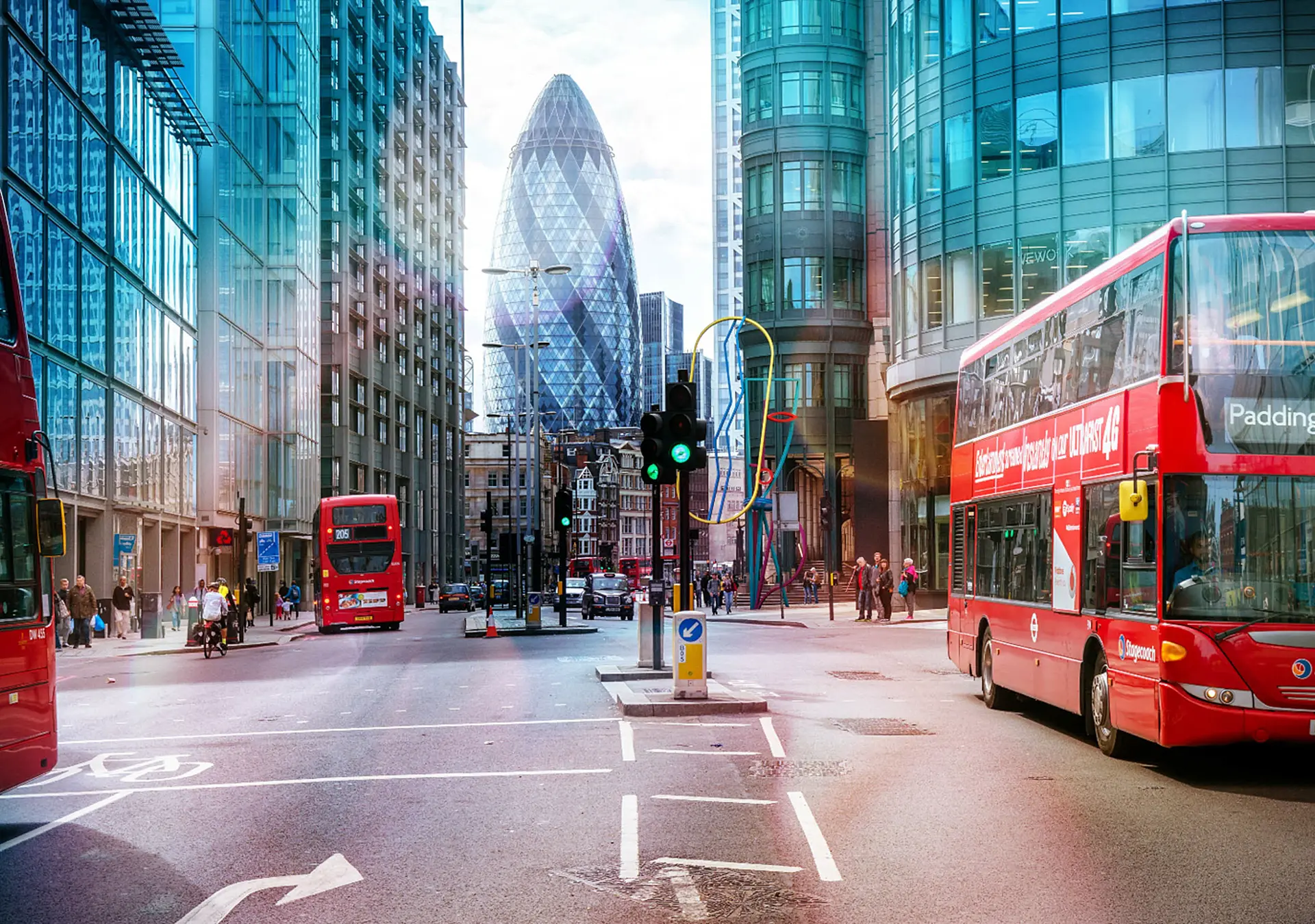 View of Street with Red Double Decker Buses, Gherkin skyscraper in the background.