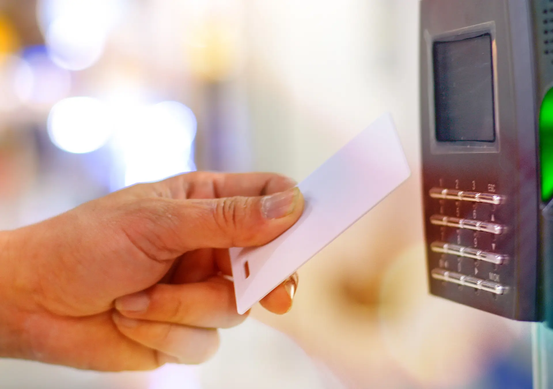 Hand on use key card to scan for unlock door security system, record office working time