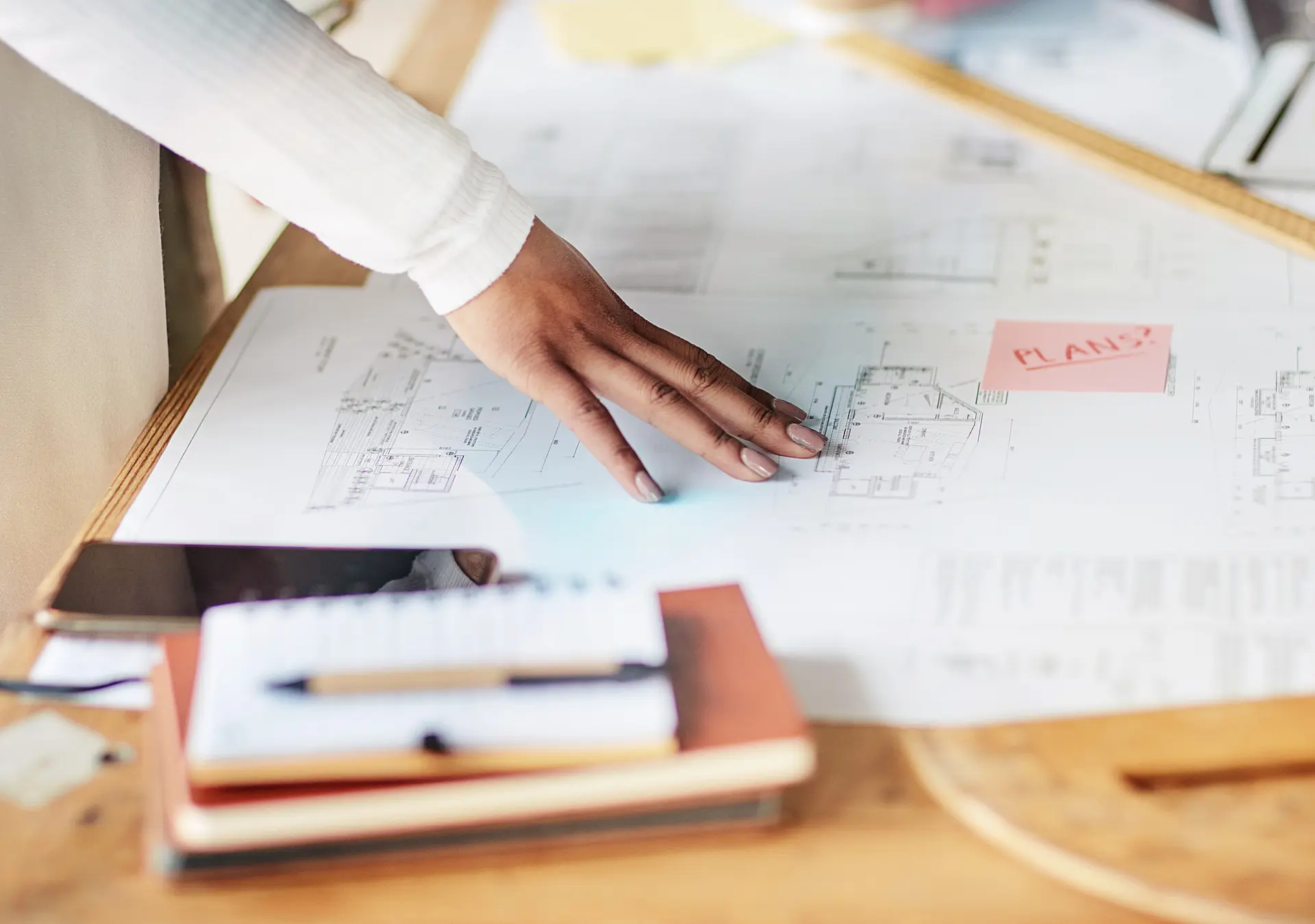 hand on an architectural blueprint