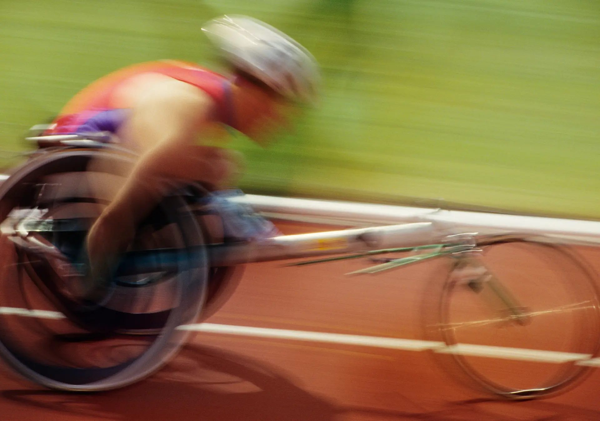 Wheelchair racer on track, side view
