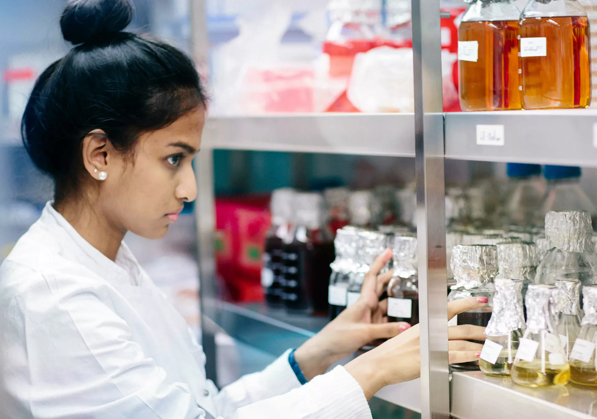Young woman standing in a cold storage room from laboratory