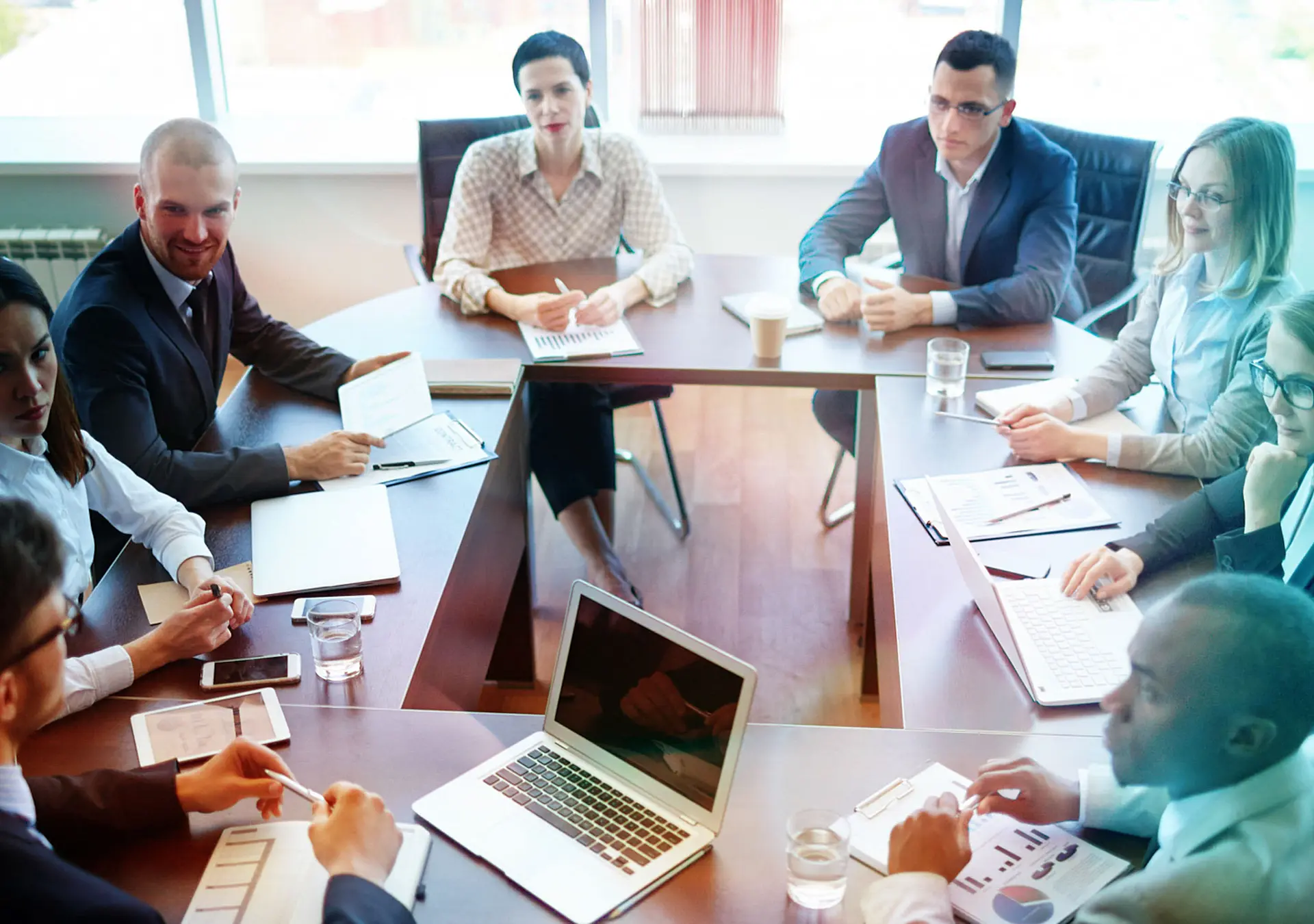 Businespeople at panel discussion in board room