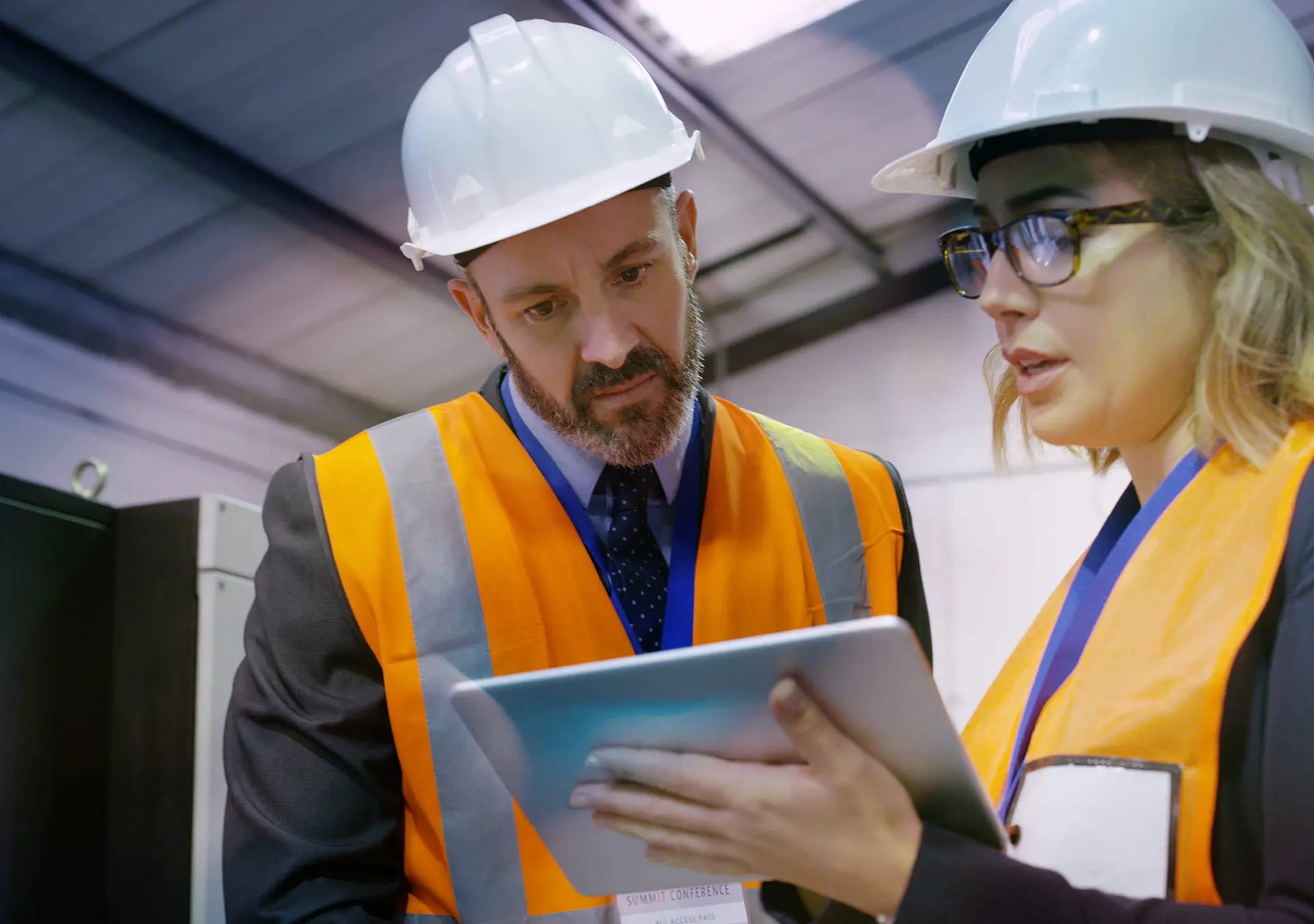 Shot of two engineers using a digital tablet together in an industrial place of work