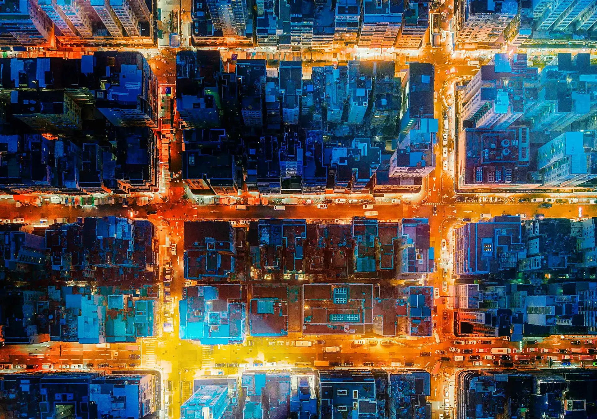 Financial district and business centers in smart city, technology. Top view of buildings at night.