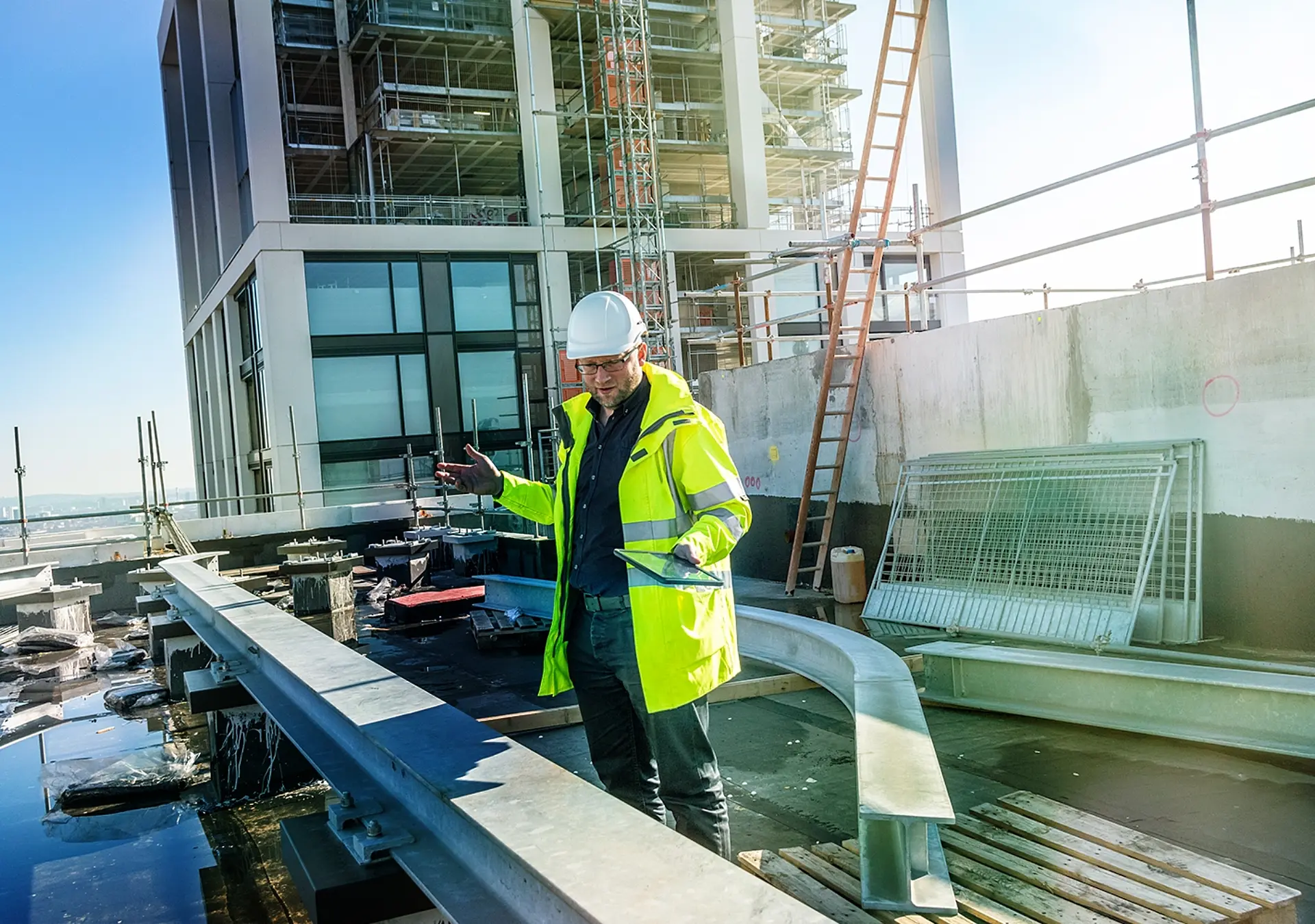 Architect inspects work at building site.