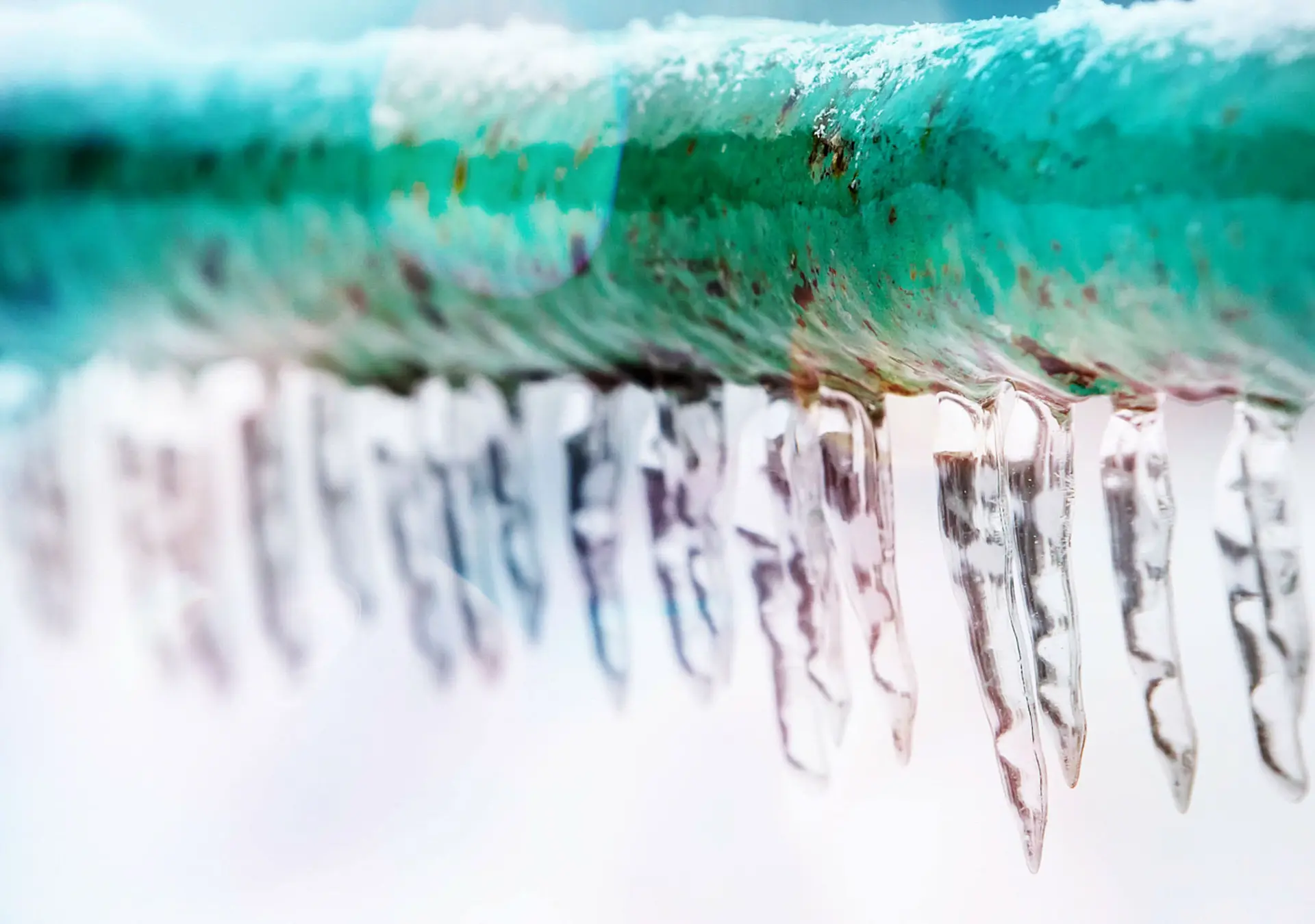 Frozen icy down pipe, icicles