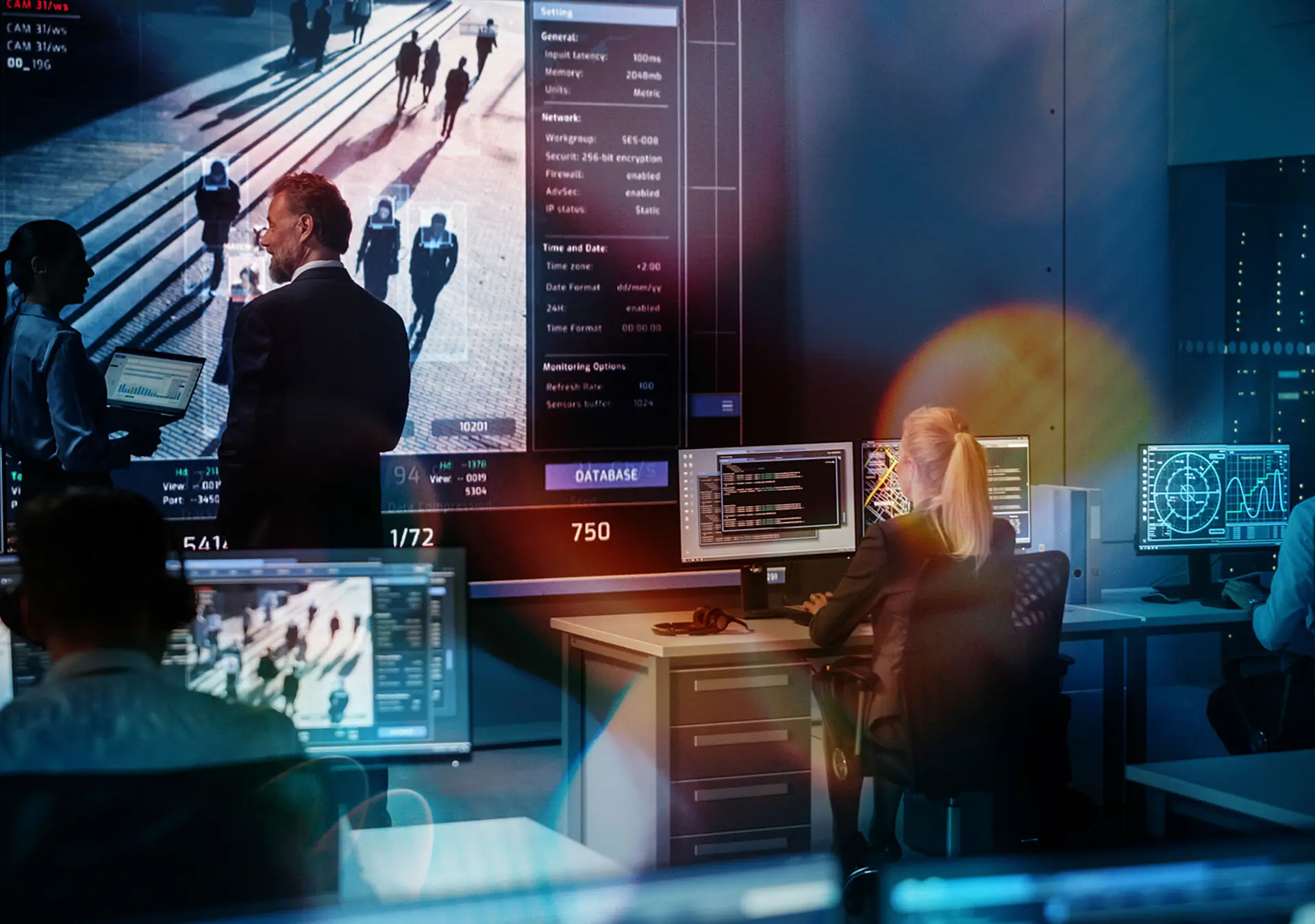 Big Digital Screen with Satellite Surveillance Footage with Face Recognition Software.