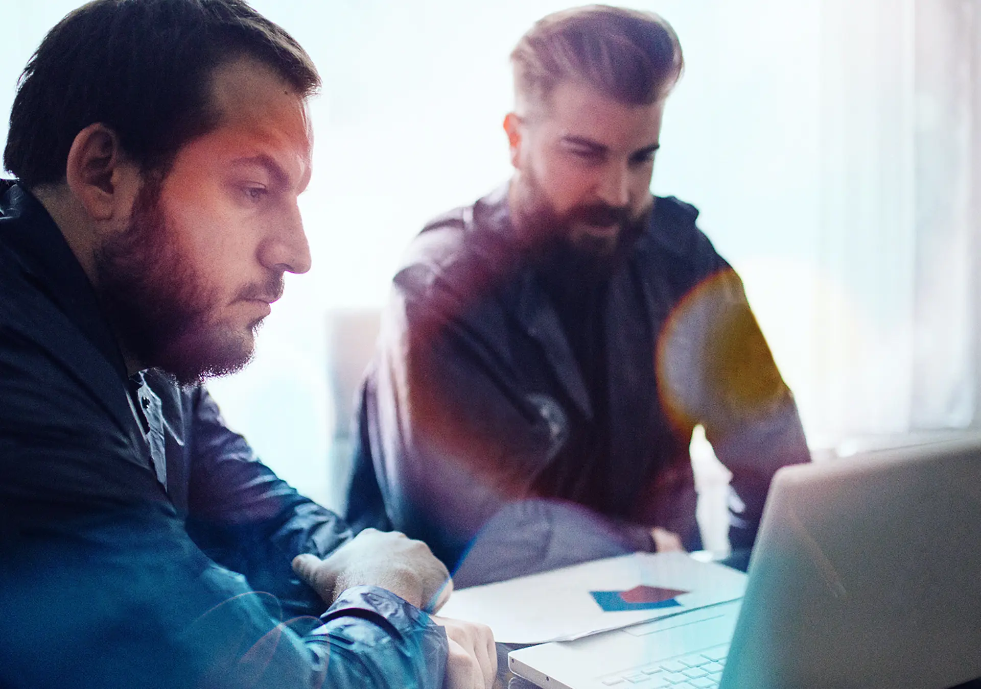BI and CSI agents working in the office on a crime. they are working on laptop