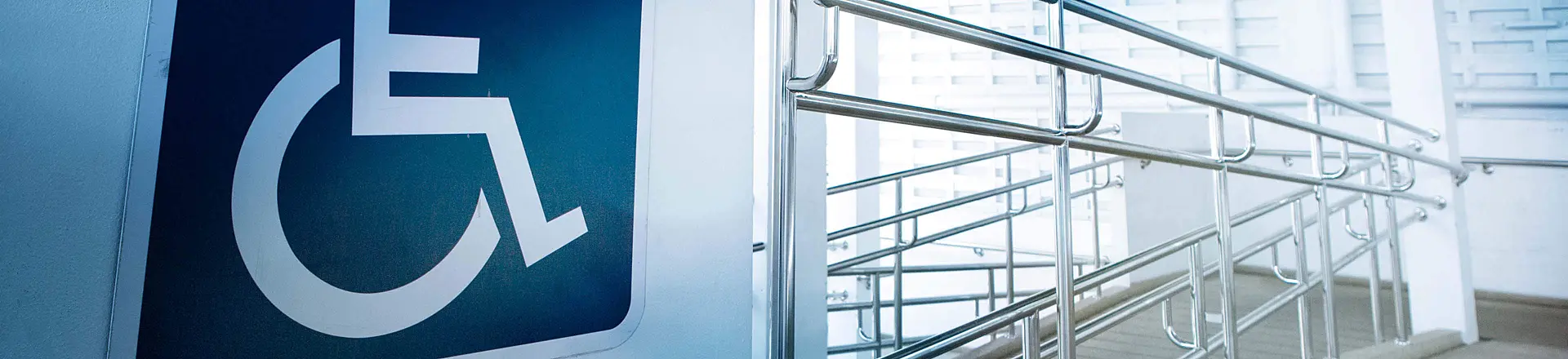 accessibility ramp with large sign
