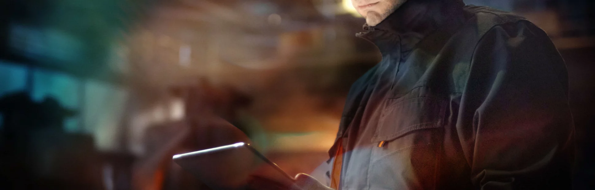 Engineer in Glasses using Tablet PC in Foundry. Industrial Environment.