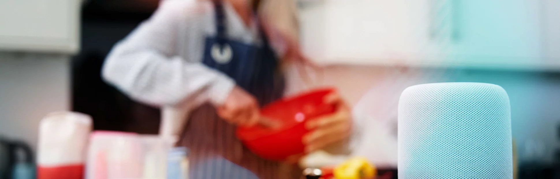 Woman Preparing Meal At Home Asking Digital Assistant Question